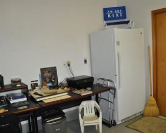 Office desk and table (37.5”x31” and 50”x31”), HP printer, GE freezer, Whirlpool Roper refrigerator.

