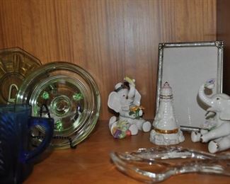 Depression glass, cobalt blue glass pitcher, Lenox elephants, Lenox lighthouse, glass salad spoon and fork.