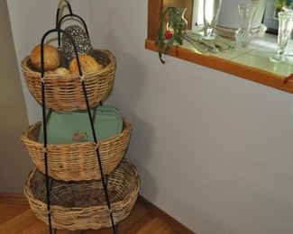 Iron stand with three baskets.
