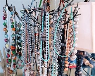 Lots of natural elements costume and silver jewelry.  Made with various stones, semi-precious stones, Amber, Turquois, Jasper, Jade, Shells, wood, etc. 