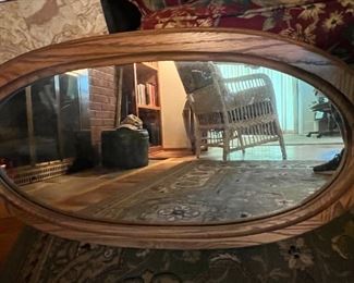 wooden framed oval mirror