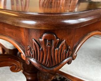 Statement Dining Room Table & Eight Chairs. This table is crafted in a beautiful timeless, classic design. It truly has a gorgeous appearance. 

The set includes eight chairs, two of which are host chairs. 

The table as shown has two leaves inserted and measures 106" x 44" x 30" (the two inserted leaves each measure 18"). With no leaves inserted, the table would measure at 70" x 44".  The table is in overall good condition with some light wear.