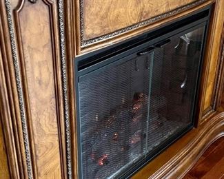 Decorative Electric Fireplace with marble top. Manufactured by Twin Star. Tested and works. Features varying degrees of temperature control. Just use the flames for beautiful ambience or heat up the room on a chilly day!  

Model no 28EF004GRS. 

Does have a crack in the corner on the top which is shown in the photographs