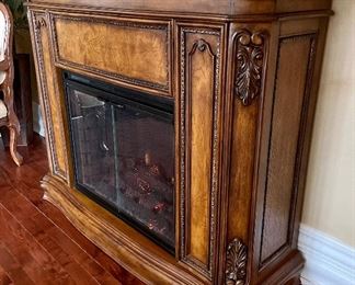 Decorative Electric Fireplace with marble top. Manufactured by Twin Star. Tested and works. Features varying degrees of temperature control. Just use the flames for beautiful ambience or heat up the room on a chilly day!  

Model no 28EF004GRS. 

Does have a crack in the corner on the top which is shown in the photographs