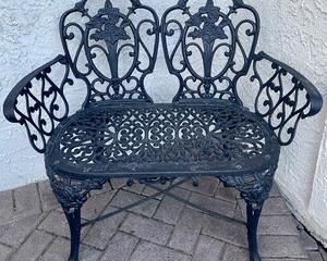 wrought iron loveseat measures 37x19x33 inches.