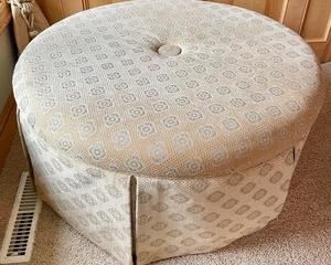 Charming Cream Circular Ottoman measures 18 inches tall and is 37 inches in diameter