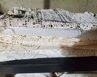 Lots of lace curtains and panels, tableclothes, etc. 