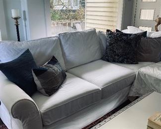 Pottery Barn “rolled arm slipcover” sectional sofa in warm white denim