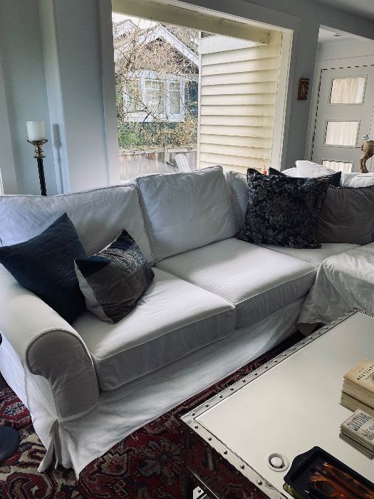 Pottery Barn “rolled arm slipcover” sectional sofa in warm white denim