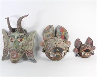 Lot 6: 3 Mexican Guerrero Painted Copper Dance Masks,Devil,Cat. Lot of three wonderful ceremonial dance masks from Northern Guerrero, Mexico. In painted copper; a horned devil and two cats or jaguars with bells hanging from their ears. The horns of the devil are real, possibly from a goat. All have holes are top and sides for hanging or to be worn. Two adult sizes and one smaller. Acquired in the 1980s, Guerrero, Mexico. From the collection of Barbara Porter & Robert Wincuinas.

Dimensions for devil are 16 in h x 13.5 in w x 6 in d. Dimensions for large cat are 13 in h x 11 in w x 4.5 in d. Dimensions for small cat  8.75 in h x 8.75 in w x 3 in d. Condition is good. Surface wear, fading paint throughout. Some dirt and dust. Please call or email for a detailed condition report. 