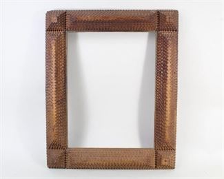 Lot 11: Antique Wood 6 Level Tramp Art Picture Frame, Folk Art. Wonderfully hand chip carved frame features a pyramid at each corner with a 6 level ridge piece on each side, and a natural borwn finish. Perfect to highlight a folk art painting, or perhaps a favorite photo.
 
Dimensions are 16 in h x 12.75 in w x 2.25 in d. Condition is very good with surface wear, a couple of loose pieces, and damage to the top left corner. Please call or email for a detailed condition report.