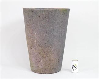 Lot 36: Tall Mid Centrury Modern Outdoor Garden Planter in Porous Stone, possibly once a crucible. A great planter for garden, patio or next to a front door. Cone-shaped in a reddish brown, porous stone.

Dimensions are 24.75 in h x 18.25 in w x 18.25 in d. Condition is good. Some wear throughout. Please call or email for a detailed condition report.