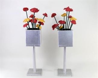 Lot 41: Carved Wood American Folk Art Sculpture,2 Flower boxes. Delightful pair of life-size silver urns on stands filled with red & yellow flowers are made of wood. Colorful and cheerful, wonderful for an entryway or perhaps on either side of a fireplace. Created in the early 1980's by New England outsider artist Robert Wincuinas.
Dimensions for each flower box are 29.5 in h x 9.75 in w x 15.75 in d. Condition is very good with minor surface wear, a couple of small paint loss spots, some discoloration. Please call or email for a detailed condition report.