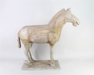 Lot 52: Chinese Terracotta Army Style Carved Wooden Horse. A carved wooden horse in style of the horses from the 200 BC Terracotta Army of the first emperor in China. Acquired in the 1980s, China. From the collection of Barbara Porter & Robert Wincuinas.

Dimensions are 26 in h x 27 in w x 9 in d. Condition is good. Surface wear and cracks throughout. Chipped in one back leg. Please call or email for a detailed condition report.