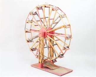 Lot 64: Delightful and large Dia De Los Muertos Ferris Wheel with 16 single skeleton riders. Made of colorfully painted wood with a hand crank which cleverly turns the wheel and takes the skeletons for a ride. Acquired in 1986 in Mexico. From the collection of Barbara Porter & Robert Wincuinas.

Dimensions are 53 in h x 15 in w x 47 in d. Condition is good. Please call or email for a detailed condition report.