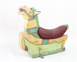 Lot 65: Carved Carnival Merry Go Round Horse, American Folk Art. Vintage early to mid 20th century carousel horse is carved and colorfully painted wood with a metal handle and red upholstered seat. Painting has been done with a naive hand. Display as a delightful sculpture or even use as a bench in your entryway. From the collection of Barbara Porter & Robert Wincuinas.

Dimensions are 35 in h x 11 in w x 40 in d. Condition is good with worn fabric on the seat. Please call or email for a detailed condition report. 