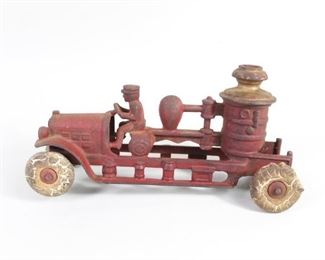 Lot 68: Kenton Toys Antique Cast Iron Fire Pump Truck w/Driver. Painted red & gold, pumper fire truck is missing one wheel, and rubber tires are in poor condition. Driver leans forward, intent on getting to the fire, oblivious to the condition of his tires.
The proceeds from the sale of this item will be donated to help fund recruitment and retention of Columbia County Volunteer Firefighters. 

Dimensions are 4.75 h x 9 in w x 3.5 in d. Condition is fair with surface wear to the paint, a missing wheel, one wheel slanted, and tires melted & cracked. Please call or email for a detailed condition report.