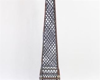 Lot 71: Outdoor Garden Tower Metal Plant Stand Obelisk Trellis. A metal plant trellis in the shape of an obelisk that can be seated directly on the ground or over a planter. Diamond pattern lattice with ball finial and ball decorations towards bottom. Great patina throughout. 

Dimensions are 64 in h x 11.5 in w x 11.5 in d. Condition is good. Surface rust. No breaks. Please call or email for a detailed condition report.