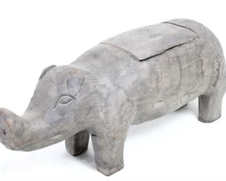 Lot 77: Large Carved Wood Pig Box,Philippines. Full of character, large pig container/box is carved of wood with a long snout and a removable lid over a carved out opening on his back, and gray patina. Display as sculpture in your entryway to welcome and surprise visitors. Acquired in the Philippines in 1978. From the collection of Barbara Porter & Robert Wincuinas.
Dimensions are 16 in h x 12 in w x 39 in d. Condition is good. Please call or email for a detailed condition report.