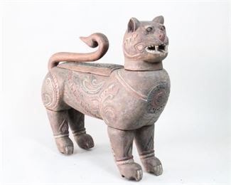 Lot 79: Antique Carved & Painted Wood Cat Box, Thailand Folk Art. Very large and extraordinary sculptural container is carved in wood with polychrome decoration and has wonderful patina. Tail and head are removable. Place in your entry as an arresting sculpture to greet visitors. Acquired in 1977. From the collection of Barbara Porter & Robert Wincuinas.

Dimensions are 32 in h x 12 in w x 34 in d. Condition is good with surface wear, cracks in the back of head and above the tail hole. Please call or email for a detailed condition report.
