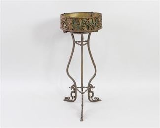 Lot 91: Electric Iron Plant Stand Bird Bath Fountain w/Light. An electric fountain in cast iron that can also function as a plant stand by removing the upper fountain part. Ornate legs and frame with grape wine and goddess motif. Wonderful inside or on a patio.

Dimensions are 34 in h x 13 in w (without fountain inset) x 13 in d. Condition is good. Overall surface wear. Some rust spots and discoloration. Fountain and light has not been tested for function. May need to be rewired. Please call or email for a detailed condition report.