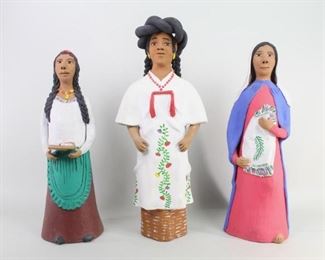 Lot 96: 3 Mexican Ceramic Pottery Women Figurines,Goacotlan. Clay sculptures of three women, in traditional clothing, one holding a towel, one holding a plate and one with a large braided crown on her head. The taller of the three is signed on the inside "J. Gaocotlan Oax." Acquired in the early 1980s, Oaxaca, Mexico. From the collection of Barbara Porter & Robert Wincuinas.

Dimensions for tallest are 23 in h x 10 in w x 7.5 in d. Dimensions for smallest are 21 in h x 7 in w x 7.5 in d. Condition is good to very good. Minor paint chip and discoloration. Please call or email for a detailed condition report.