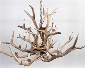 Lot 98: Huge 4.5 Ft Real Elk Antler Chandelier,Adirondack Lodge. Dramatic hanging light fixture is made of real elk antlers and has over a dozen lights. Approximately 10 feet of bronze colored chain included for suspending from a beam or ceiling. Fantastic lighting for the great room of your Adirondack or Western style lodge or camp. 
The lamp has not been tested for function, may need to be rewired.

Dimensions are 32 in h x 54 in w x 54 in d. Condition is good with one bulb broken. Please call or email for a detailed condition report.