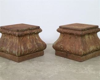Lot 107: Pair of Cast Iron Column Bases Garden Plant Stands. Made of cast iron, these stands each have 4 curved sides, and a removable square top which opens to reveal a hollow interior. Frame the opening to a garden path with this matching pair, with pots of flowers resting on top.

Dimensions are 12 in h x 14.5 in w x 14.5 in d. Condition is good with some rusting and pitting. Please call or email for a detailed condition report.