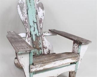 Lot 108: Painted Adirondack Garden Patio Lounge Chair. An Adirondack chair with a fun and unusual design. The back has an hourglass shape reminiscent of a Fleur-de-lis and is painted green and white throughout. Deep seat and wide arm rests makes this a comfortable classic.

Dimensions are 39.5 in h x 14 in seat h x 30 in w x 29 in d. Condition is fair. Paint chipping throughout and mostly gone on arm rests and seat. Please call or email for a detailed condition report.