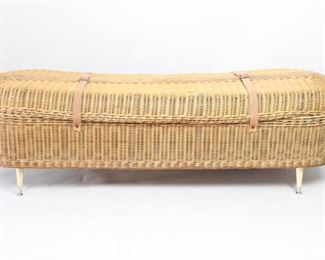 Lot 117: Undertakers Wicker Coffin Casket Carrier,Coffee Table. A body carrier or transfer casket made in wicker with solid wood bottom. Black interior lining on bottom, wicker handles and leather straps to keep it closed. From the 19th or early 20th century. Mid-century modern has been added to be able to use as a coffee table. Skeleton sculpture not included. Sold in the same auction in a separate lot.

Dimensions are 23 in h x 24.25 in w x 77 in d. Condition is good. Overall surface wear and scratches. Wear/broken wicker on handles. Some wear to interior lining. Please call or email for a detailed condition report.