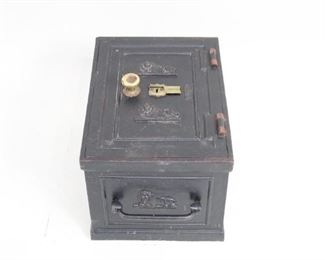 Lot 124: 19th C Cast Iron Cash Safe Strong Box w/Lions by Cannon. An antique strong box by Cannon made in cast iron. Painted black on the outside with brass hardware and brick red on the inside. Decorated with lions on all sides. Crest on top slide to the side to reveal the key hole.

Dimensions are 14 in h x 13.25 in w x 20.5 in d. Condition is good. Dented brass handle. Some wear to black paint. Please call or email for a detailed condition report.
