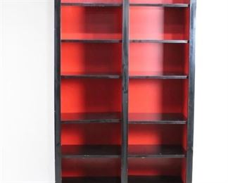 Lot 135: Massive 7 Shelf Red & Black Shelving Unit, Bookcase. Huge and tall bookshelf is made of wood painted black, with the backdrop and back painted contrasting bright red. So much storage available in this impressive piece of furniture. Can be disassembled for transport. The second of two similar shelves in this auction, with slightly different measurements.
Dimensions are 104 in h x 56 in w x 22.5 in d. Condition is fair with wear to paint and wood, and damage at bottom right side. Please call or email for a detailed condition report.