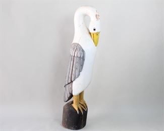 Lot 138: Large Carved Indonesian Wooden Sea Bird Sculpture. Beautifully carved and painted sculpture of a large sea bird, perching on a wood base. Each of the feathers on the wings are carved out. Acquired in the 1980’s, Indonesia. From the collection of Barbara Porter & Robert Wincuinas. 

Dimensions are 59 in h x 13 in w x 13 in d. Condition is good. Surface wear throughout. Crack on side of the body and base. Paint chipping in spots. Slightly wobbly stand. Please call or email for a detailed condition report.