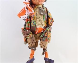 Lot 146: Pirate Puppet Sculpture Marionette by Marjorie Moore. Fantastic marionette of a pirate by Maine artist Marjorie Moore (b. 1944). Papier mache head, wood structured and stuffed body, wooden hands and soles of feet. Great hand made clothing and boots. Made in 1973. This is the first of two lots of marionettes by Moore. From the collection of Barbara Porter & Robert Wincuinas.

Dimensions are 35 in h x 9 in w x 6 in d. Condition is good. Some surface wear throughout. Minor dust. Please call or email for a detailed condition report.