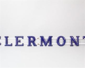 Lot 173: 8 ft W Enamel Gas Station Sign,Clermont New York. A gas station sign from Clermont, New York with dark blue enamel letters affixed to two white enamel bars. Perfect for another Clermont retail shop, store front or perhaps as wall decor.

Dimensions are 10 in h x 105 in w x 1 in d. Condition is good. Minor rust spots and wear to enamel. Please call or email for a detailed condition report.
