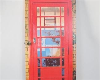 Lot 181: Door Covered in Life Sized British Telephone Box Mural. Fun interior door with doorknob has a full size image of a red British telephone booth applied to one surface. Terrific for a closet, bathroom or gameroom entryway.
Dimensions are 80 in h x 32.5 in w x 6 in d. Condition is good to fair with surface wear, small wear spots throughout, small scuffs and some damage where hinges were attached. Please call or email for a detailed condition report.