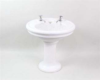 Lot 187: Antique 2-Piece Porcelain Oval Pedestal Bathroom Sink. Beautiful porcelain sink on pedestal base. Round or oval basin with two faucets, in slightly different styles, with "cold" written on both.

Dimensions are 33 in h x 27 in w x 22 in d. Condition is good. Wear and crazing throughout. Cracks and small chip on base. Please call or email for a detailed condition report.