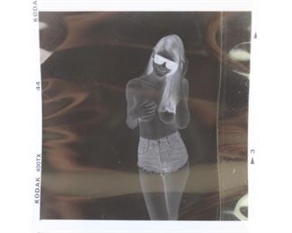 Lot 232: Jonathan Leder: Roll of 7 Photographic Negatives,Nudes. A roll of seven negatives of a topless woman wearing shorts and sunglasses by Jonathan Leder.

Dimensions are 33.5 in h x 2.5 in w. Condition is excellent. Please call or email for a detailed condition report.