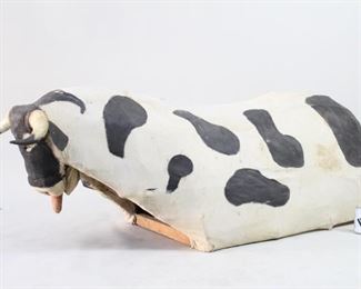 Lot 245: Bullfighting Jaripeo Practice Bull,Mexican Folk Art. Spectacular practice bull fighting bull for beginning bull fighters is made of painted fabric stretched over a bent wood frame, with real horns. Acquired in Oaxaca, Mexico 1984. From the collection of Barbara Porter & Robert Wincuinas.

Dimensions are 26 in h x 31 in w x 73 in d. Condition is good. Please call or email for a detailed condition report.