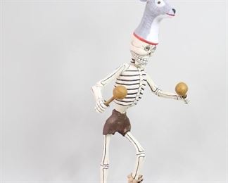 Lot 251: Day of Dead Dancing Deer Skeleton,Mexican Folk Art 2/2. Large Día de los Muertos Dancing Skeleton is wearing a helmet mask with an antlered deer head, standing on one foot (mounted on block of wood) and is holding maracas. Fanciful and fun figure is made of carved wood with painted polychrome decoration. There is another similar skeleton listed separately. Acquired in Veracruz, Mexico in 1986. From the collection of Barbara Porter & Robert Wincuinas.

Dimensions are 58 in h x 23 in w x 18 in d. Condition is good. Please call or email for a detailed condition report.