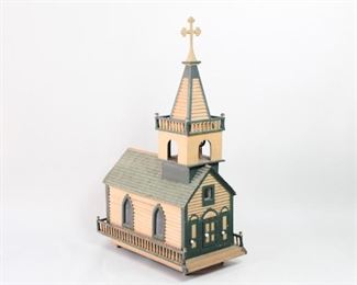 Lot 258: Miniature Folk Art Model Church House w/Steeple Bell. A highly detailed, large model of a church complete with a steeple bell. The interior, accessed through the front door, has; a lit alter, two porcelain statues of Jesus and Mary, eight removable wooden pews and is decorated with a floral wall paper throughout. Acquired in the 1980s, Massachusetts. From the collection of Barbara Porter & Robert Wincuinas.

Dimensions are 52 in h x 17 in w x 31 in d. Condition is good. Surface wear throughout. Some discoloration and paint chipping in some spots. The light has not been tested for function. May need to be rewired or replaced. Please call or email for a detailed condition report. 