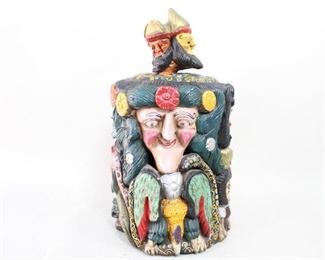 Lot 261: Mexican Folk Art Carved & Painted Tree Trunk Sculpture. An extensively carved and colorfully painted, hollowed out tree trunk from Mexico. The top has a four-headed finial with bearded men in crowns. The trunk itself features various figures of men in different costumes, mermaid, snakes, toads and lizards. Acquired in the1980s, Mexico. From the collection of Barbara Porter & Robert Wincuinas.

Dimensions are 33 in h x 17 in w x 17 in d. Condition is good. Surface wear throughout. Has been previously repaired. Cracks around the top and sides. Please call or email for a detailed condition report.