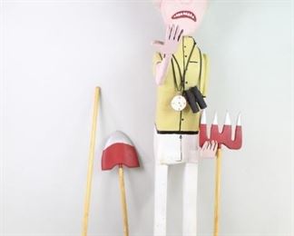 Lot 264: Carved Wood American Folk Art Sculpture,Archaeologist. Wonderful large and colorful sculpture is made of carved wood with polychrome decoration. White haired explorer/archaeologist is well equipped with a compass, binoculars and a rake, shovel and pitchfork. His aggravated look makes one think he may be having a hard time finding treasures. Created in the early 1980's by New England outsider artist Robert Wincuinas.
Dimensions are 43 in h x 11 in w x 17.25 in d. Condition is good with minor surface wear, a couple of small paint loss spots, some discoloration, cracks & repairs. Please call or email for a detailed condition report.