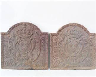 Lot 275: Pair French Style Cast Iron Firebacks w/Fleur de Lis. Handsome matching pair of firebacks are decorated with a coat of arms with fleur de lis in the center, with a crown at the top and feathers on either side. All of the firebacks in this auction were found locally in a barn; they show good age but we are unsure of their actual manufacture date.
Dimensions are 18.5 in h x 18.5 in w x .75 in d. Condition is fair with surface oxidation throughout. Please call or email for a detailed condition report.