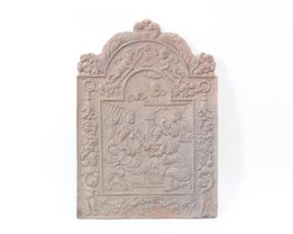 Lot 280: Cast Iron Fireback w/Cherubs,Family & Horns of Plenty.  Handsome fireback is decorated with a domestic scene in the center, with a surround representing love and prosperity with cherubs, fruit and horns of plenty. All of the firebacks in this auction were found locally in a barn; they show good age but we are unsure of their actual manufacture date.
Dimensions are 39 in h x 27.25 in w x .75 in d. Condition is fair with surface oxidation throughout. Please call or email for a detailed condition report.