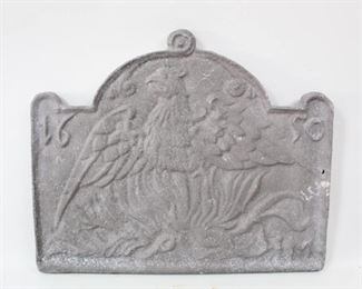 Lot 282: Large Cast Aluminum Fireback w/English Phoenix 1650. Handsome fireback is decorated with a Phoenix rising from the flames, and 1650. All of the firebacks in this auction were found locally in a barn; they show good age but we are unsure of their actual manufacture date.
Dimensions are 21 in h x 26 in w x 1 in d. Condition is good with some spots of surface oxidation throughout. Please call or email for a detailed condition report.