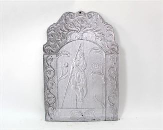 Lot 283: Cast Aluminum Fireplace Fireback w/Explorer w/Spear. Handsome fireback is decorated with an explorer with a spear in hand, with grapevines on either side. All of the firebacks in this auction were found locally in a barn; they show good age but we are unsure of their actual manufacture date.
Dimensions are 29.5 in h x 19.75 in w x 1 in d. Condition is good. Please call or email for a detailed condition report.