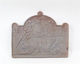 Lot 285: Large Cast Iron Fireback w/English Phoenix 1650. Handsome fireback is decorated with a Phoenix rising from the flames, and 1650. All of the firebacks in this auction were found locally in a barn; they show good age but we are unsure of their actual manufacture date.
Dimensions are 21 in h x 26 in w x 1 in d. Condition is fair with surface oxidation throughout. Please call or email for a detailed condition report.