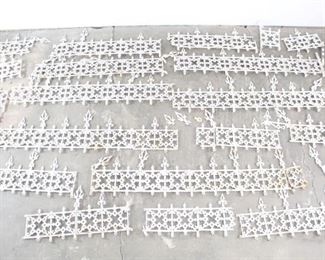 Lot 288: Huge Lot Cast Iron Widow's Walk Edging. 22 Pieces/Panels of antique widow's walk edging are made of cast iron in an ornate Victorian style, and painted white. Use as originally intended in your Victorian home renovation, or perhaps to edge your urban garden or front yard. 
Dimensions of the largest section are 19 in h x 66 in w x 2 in d. Condition is good to fair, with some pieces broken off, some rust and minor paint loss. Please call or email for a detailed condition report.
