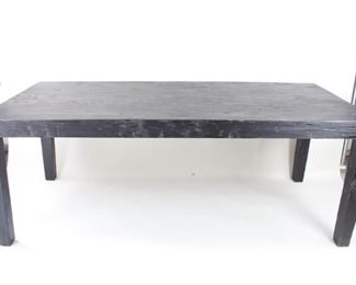 Lot 301: Minimalist Black Stained Wood Modern Dining Table (2/2). Simple yet substantial table has a chiseled texture on the surface  and is finished in black. Legs are removable (constructed with 2 nuts & bolts each) for easier transport. Use for dining, or as a work table for your studio. This is the second out of two similar tables in this auction. 
Dimensions are 30.25 in h x 78.75 in w x 36 in d. Condition is very good with some buildup/discoloration in the deeper grooves. Please call or email for a condition report.